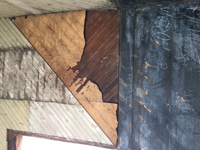 Original beadboard paneling inside the schoolhouse